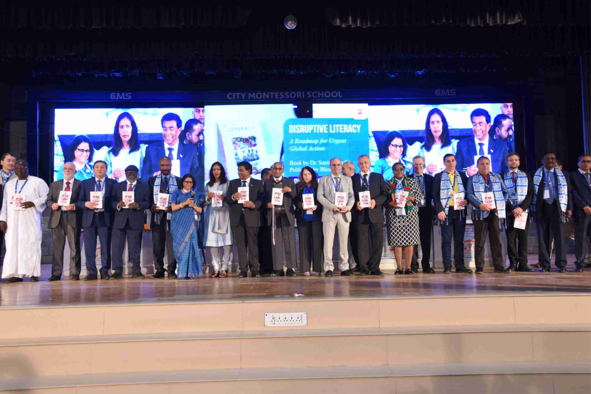Speakers and dignitaries on stage at City Montessori School for the launch of the book Disruptive Literacy
