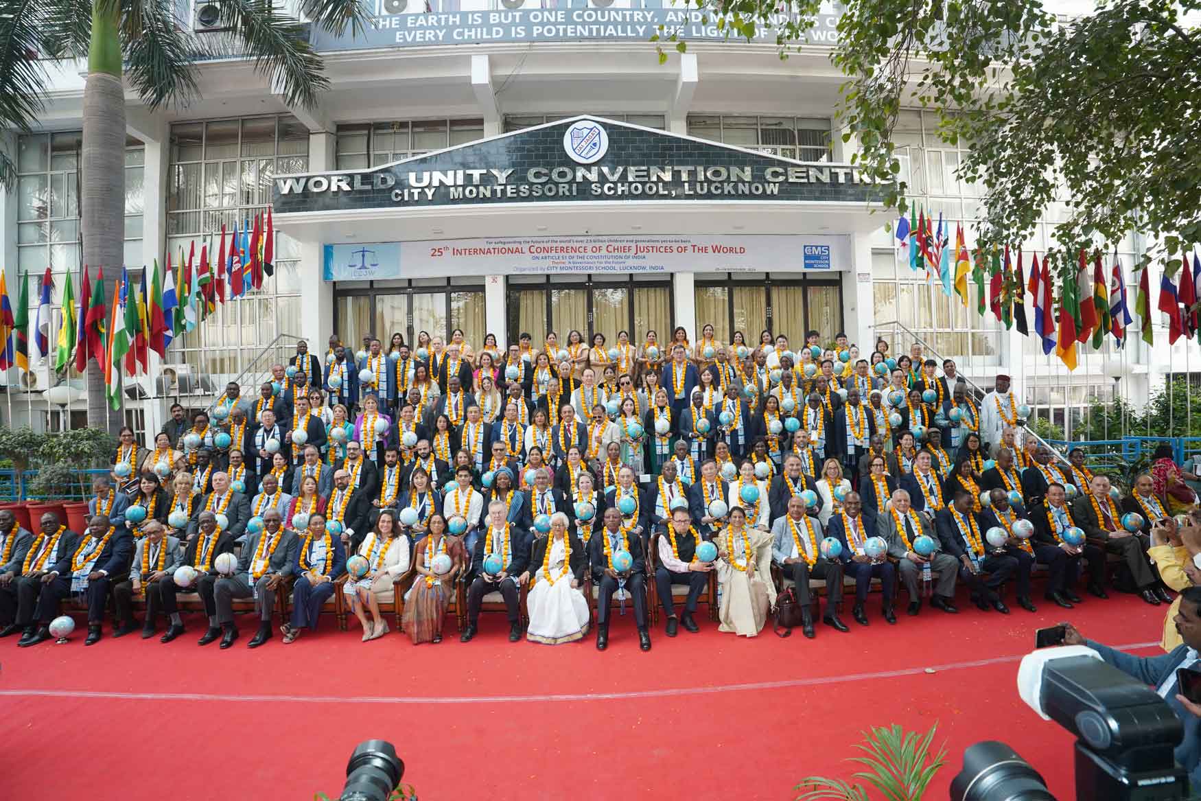 International delegates gathered on the steps of the World Unity Convention Centre, City Montessori School, Lucknow